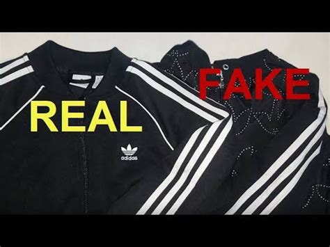 fake adidas jacket with|real adidas zip jacket.